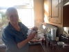 Mum bottling her homemade Blackberry Vodka